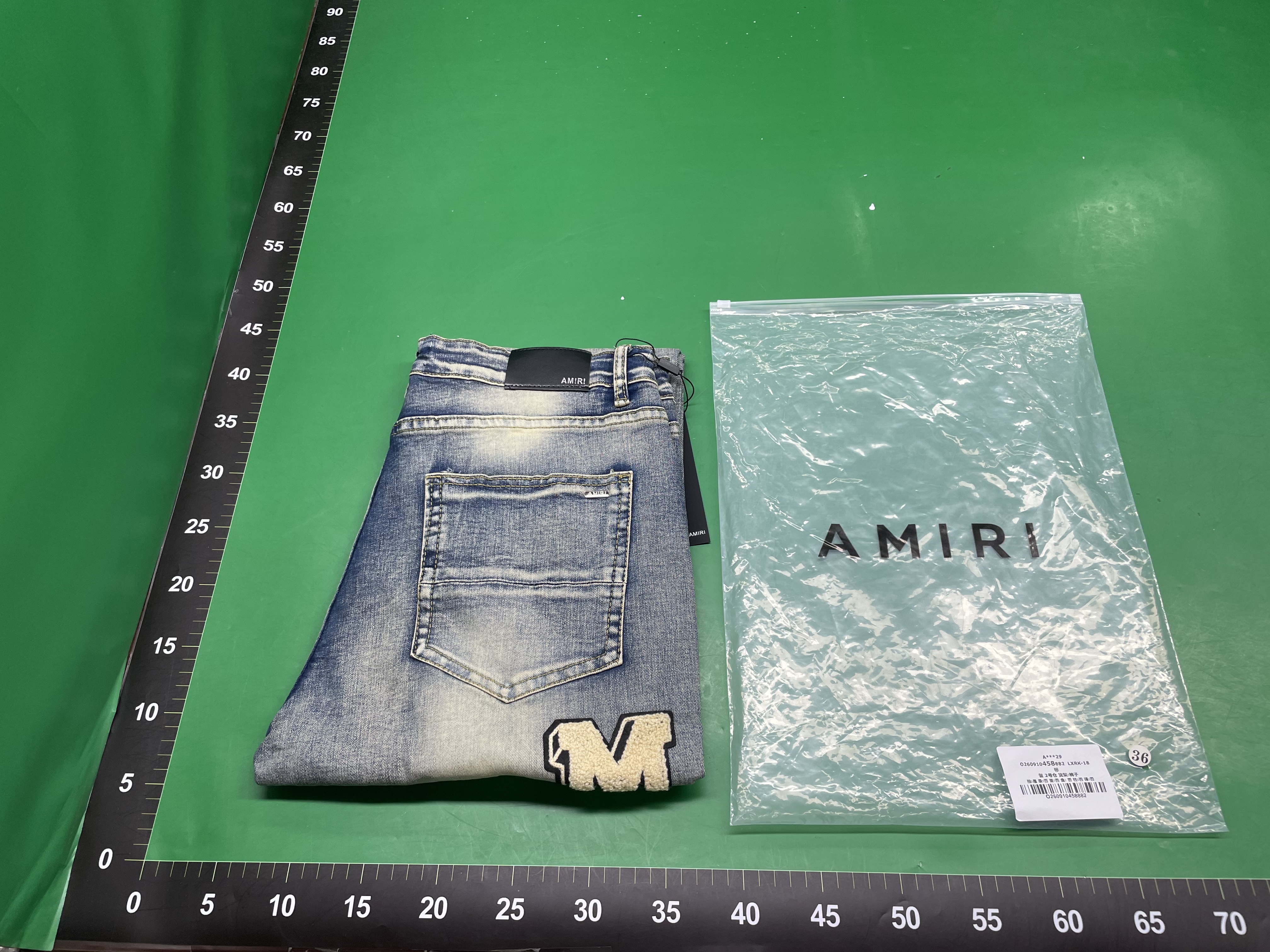 24跨境欧美潮牌amri刺绣破洞贴布休闲牛仔长裤男女高街做旧牛仔裤 — foto QC 1